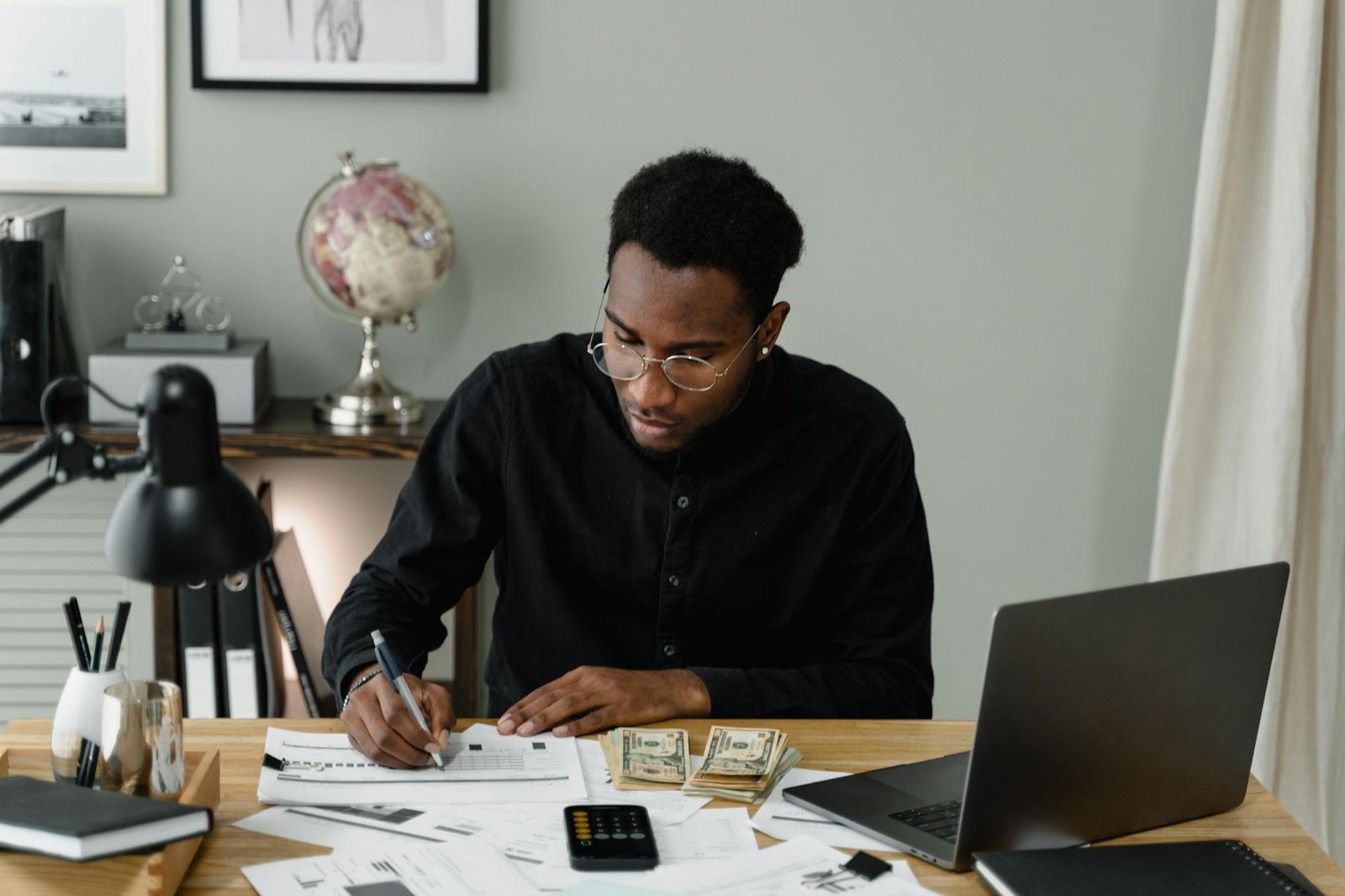 a man writing on the paper
