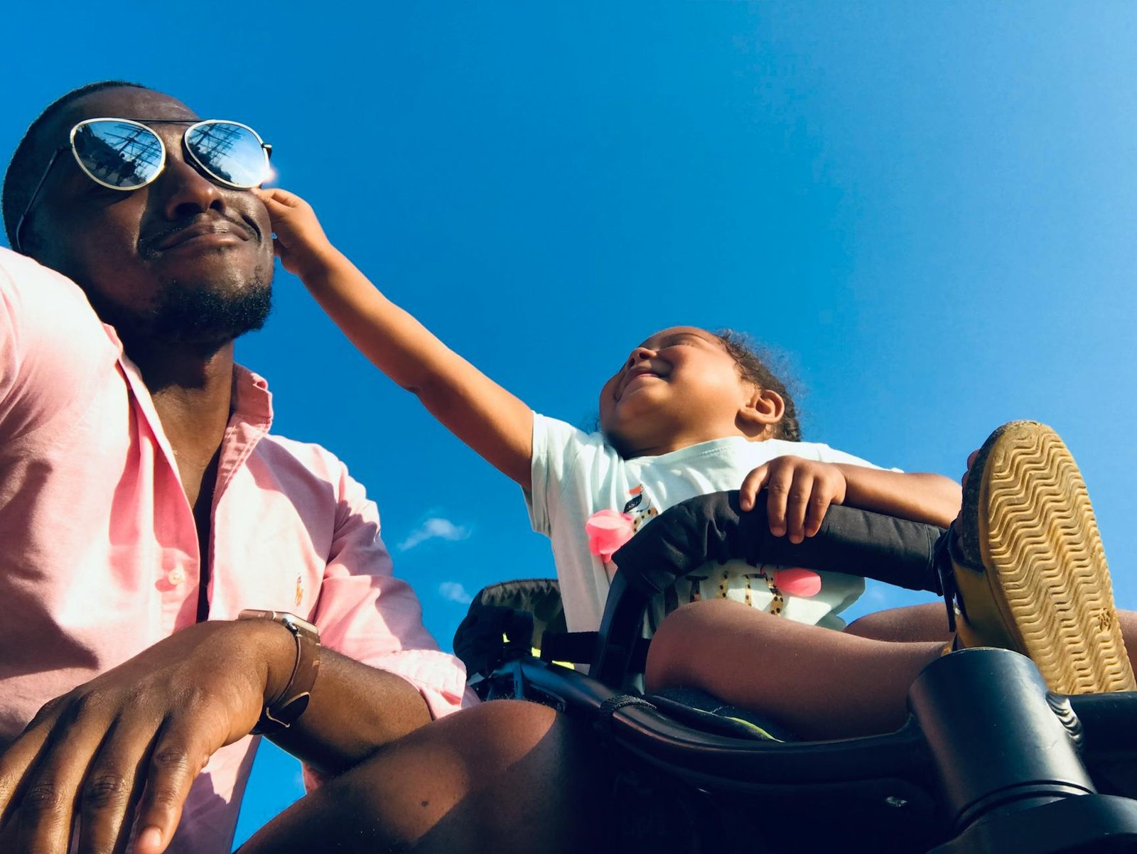 a child touching father s face