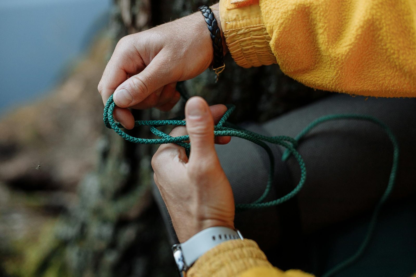 person holding a green rope